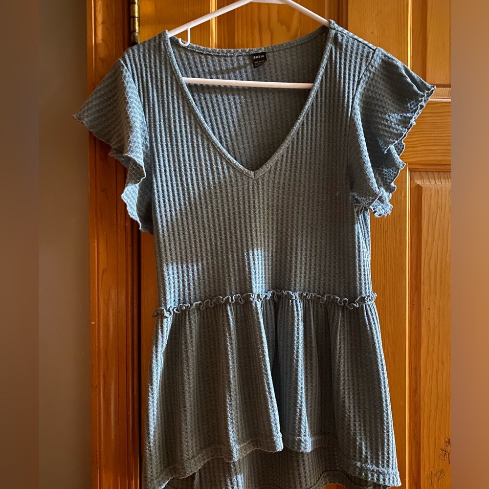Large, dusty blue blouse